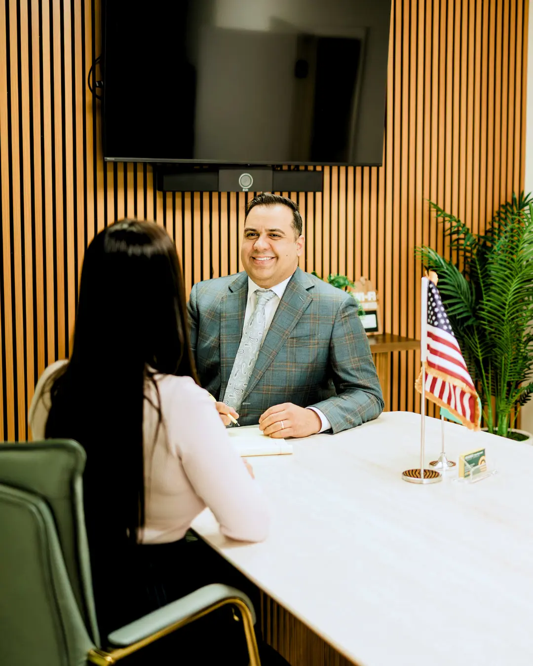 Mavro and client talking at office